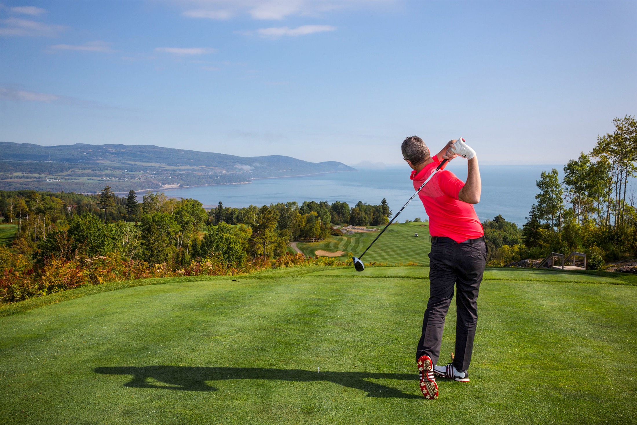 man swinging a golf club