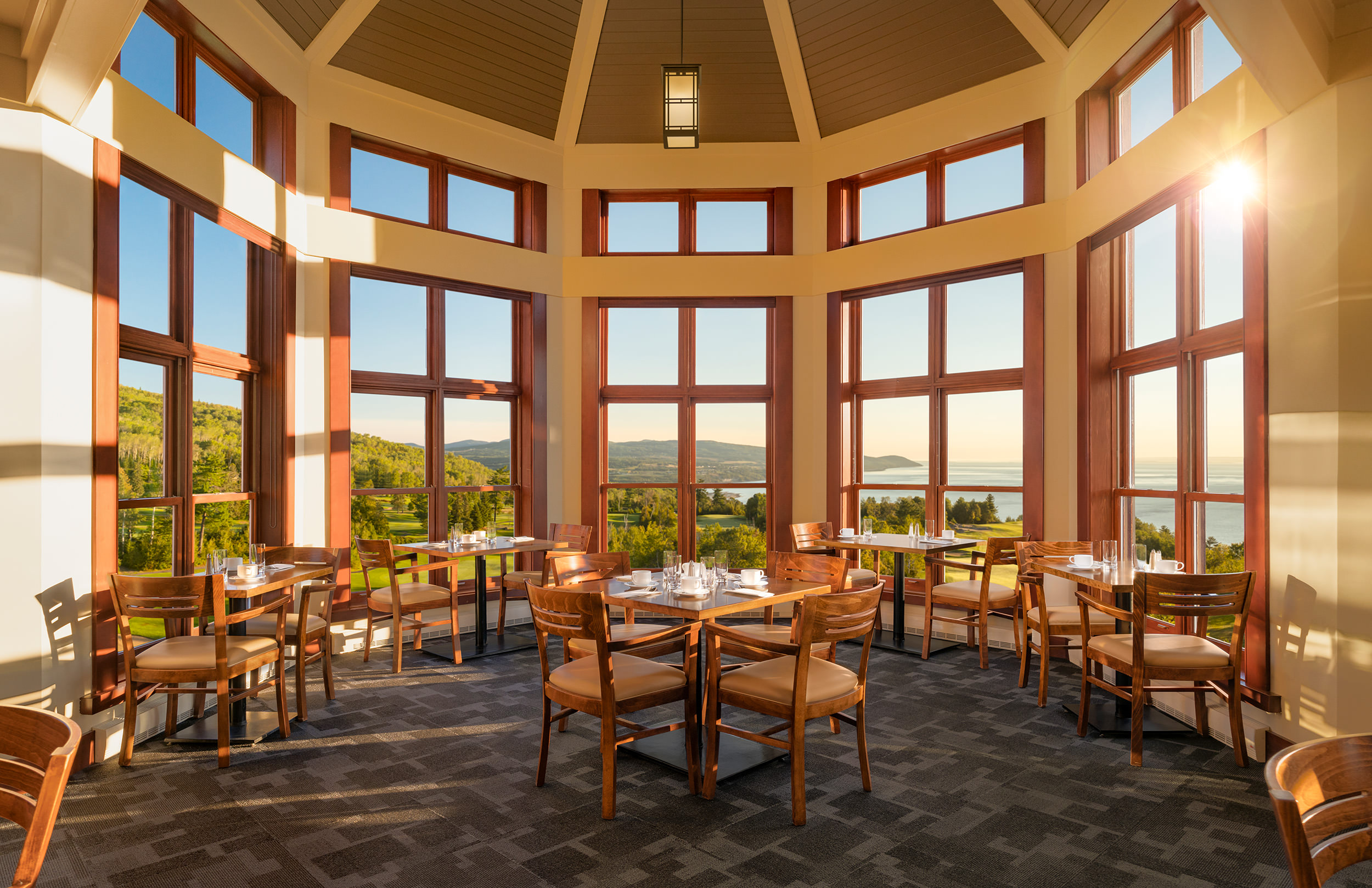 dining area of le point cardinal overlooking the golf course
