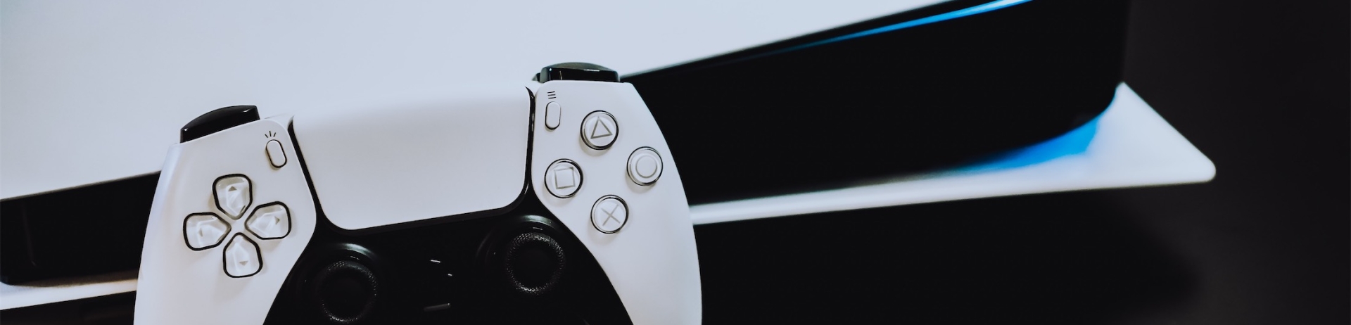 gaming controller leaning on a gaming system