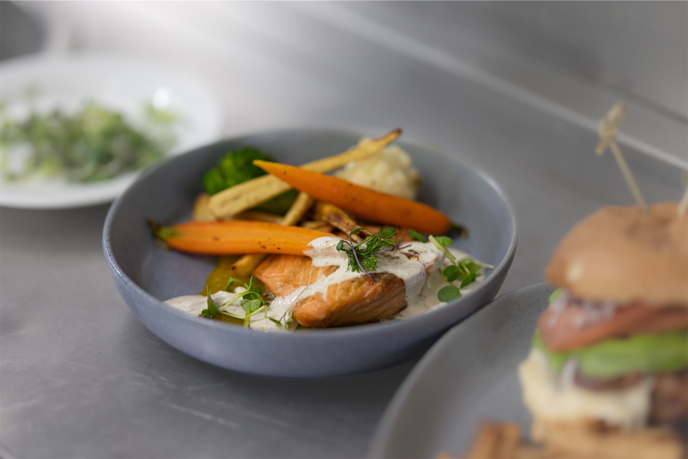 bowl of salmon and root vegetables