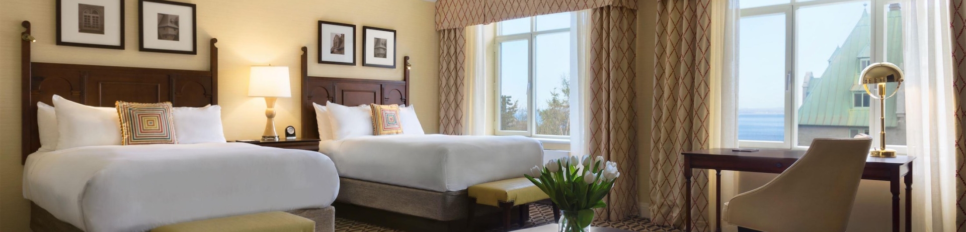 bedroom with two beds, a desk and a sofa