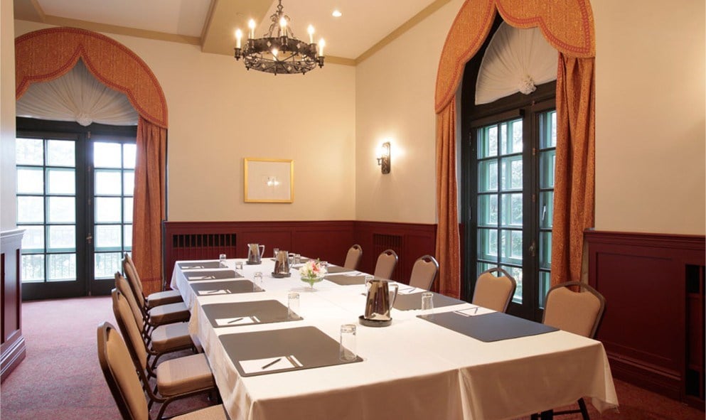 room with a long table set up for a meeting