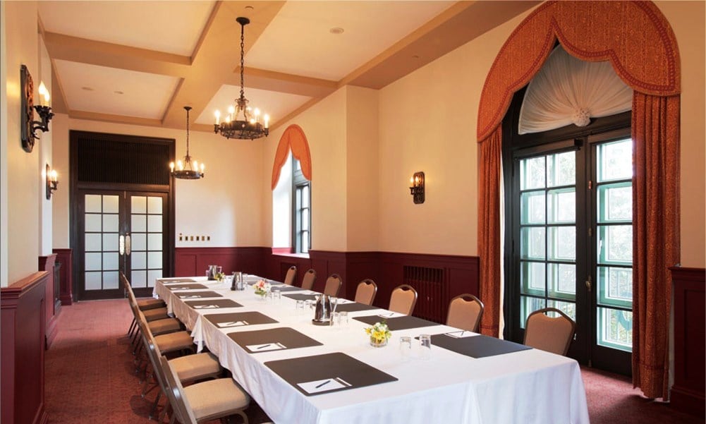 room with a long table set up for a meeting