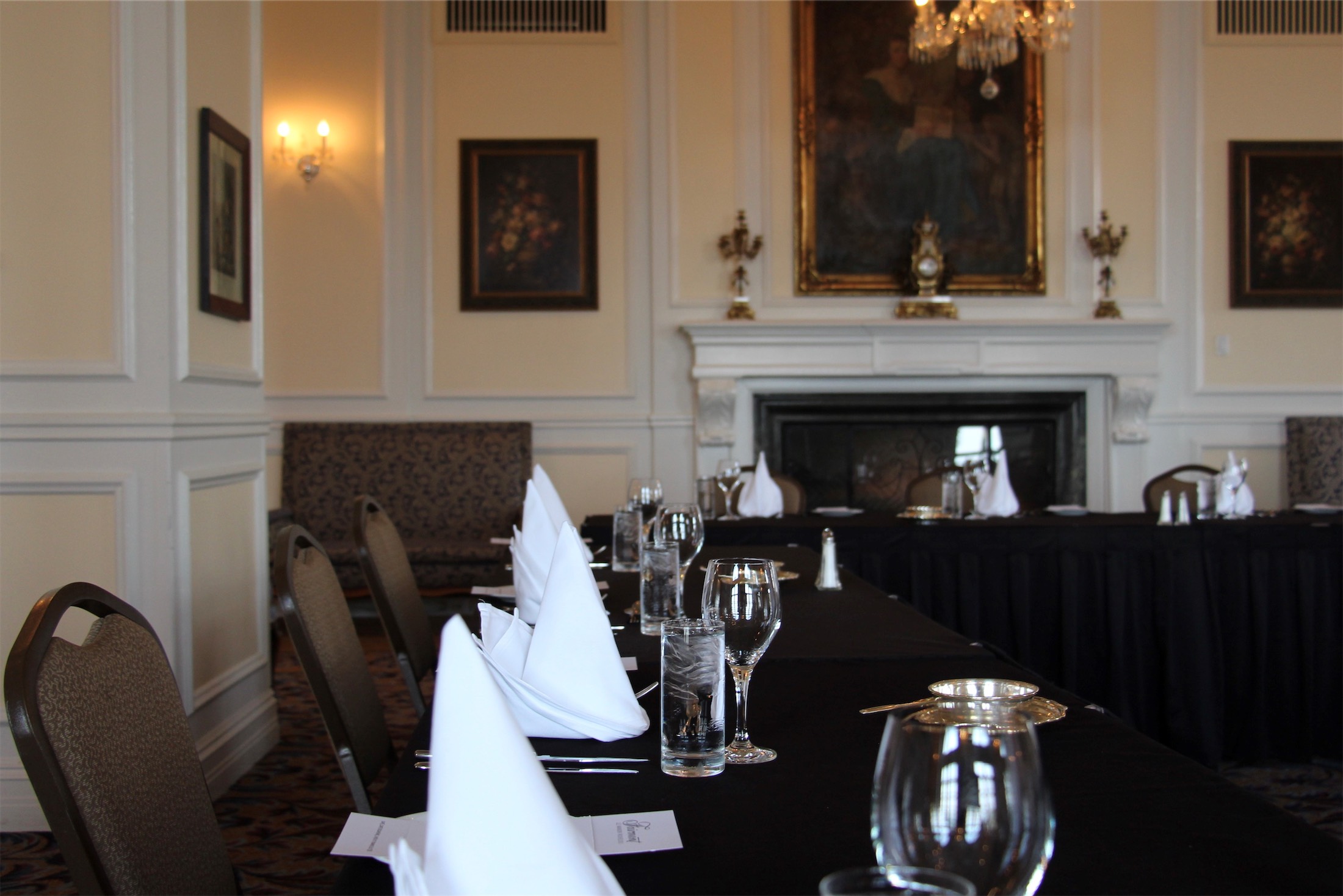 close up of a meeting table with folded napkins and water glasses