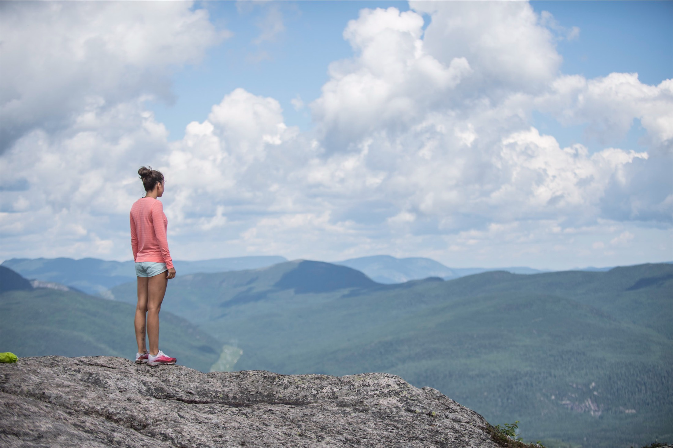 woman looking off a cliff