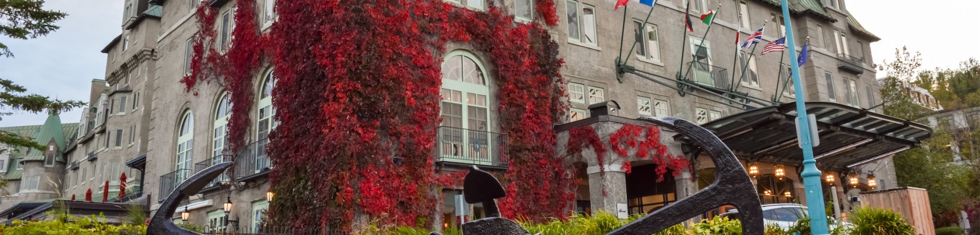 vines of red leaves crawling up the side of manoir richelieu