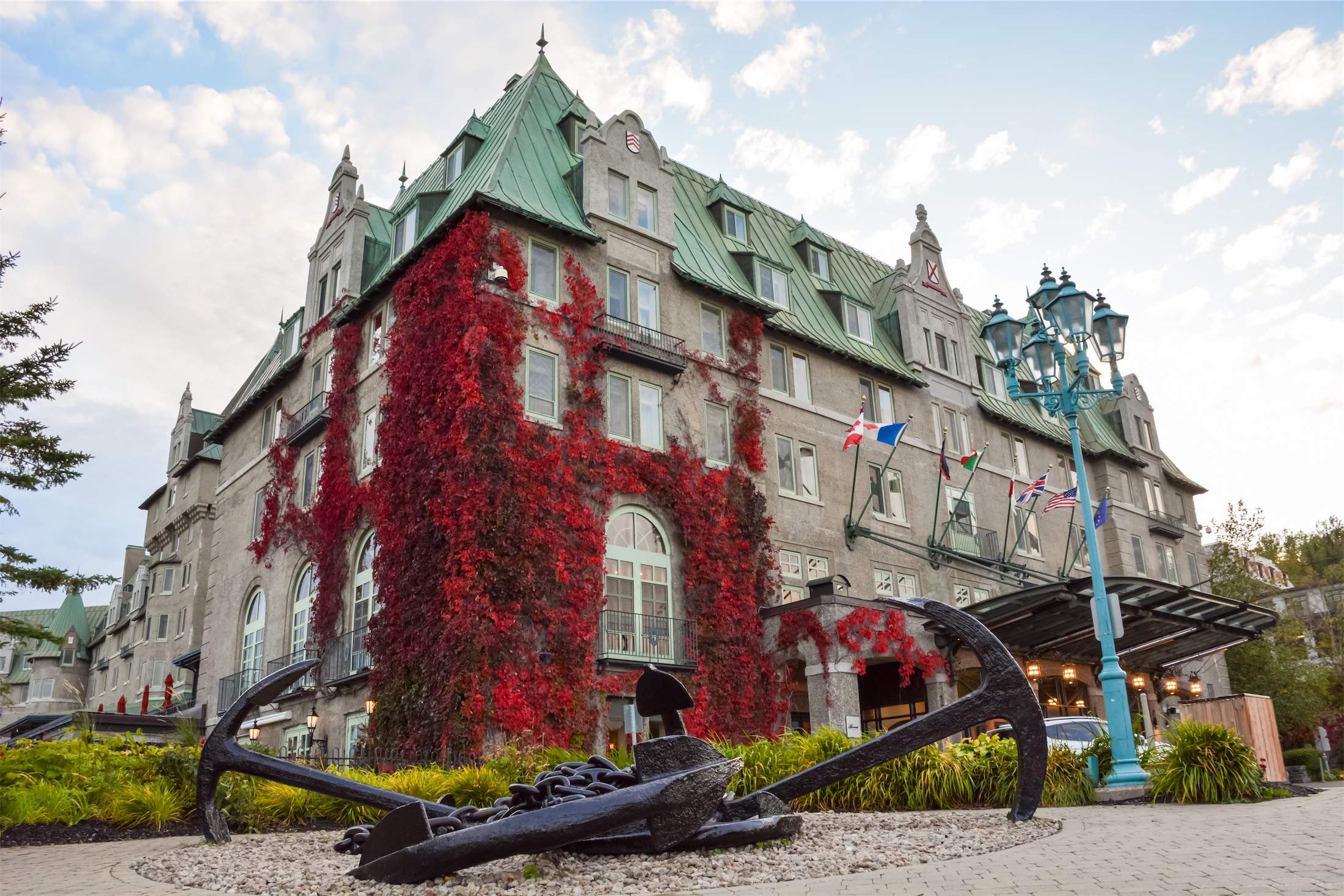 vines of red leaves crawling up the side of manoir richelieu